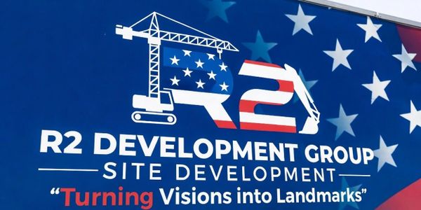 Logo of R2 Development Group with patriotic American flag theme.