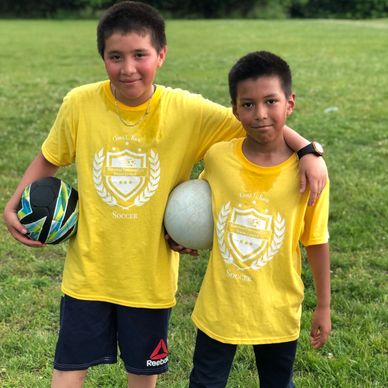 2 Student Athletes Embrace After A Fun Afternoon Of Soccer