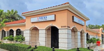 Exterior of Xpress Urgent Care building with clear signage.