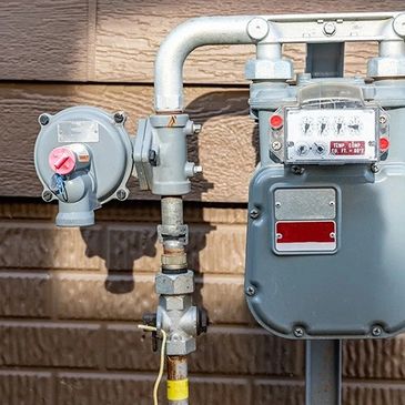 A gas meter with a regulator providing natural gas to the home