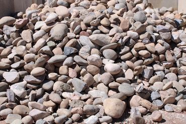 Cobble Stone. Great for landscaping but also used as building material.