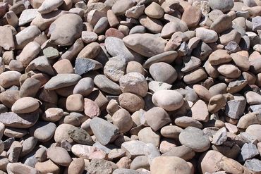Cobble Stone. Great for landscaping but also used as building material.