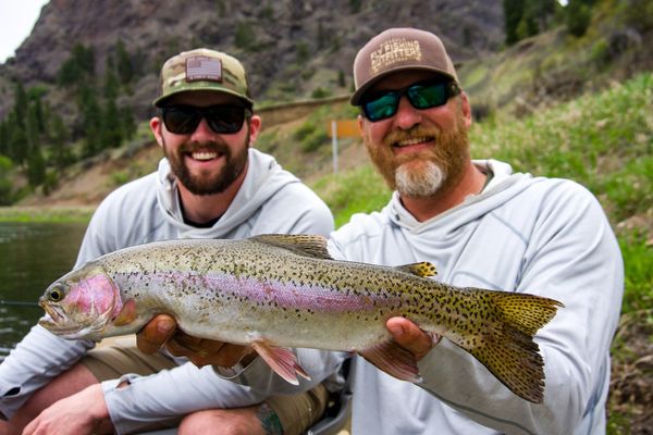 Beginner Fly Fishing on the Missouri River Montana and Montana Fishing Guide holding Rainbow trout