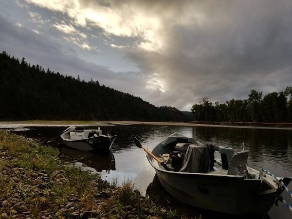 Clark Fork River Drift Boats anchored near rocks while Fly Fishing Missoula