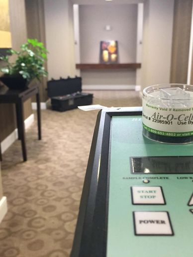 Home Enviro Licensed Mold Inspector conducting air quality testing.