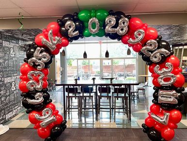Casino themed roulette wheel balloon arch