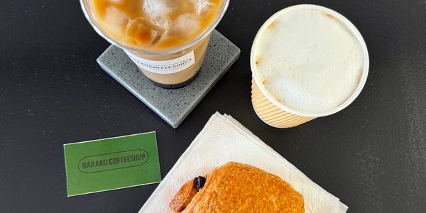 Iced coffee, hot coffee, and a pastry from Barako Coffeeshop.