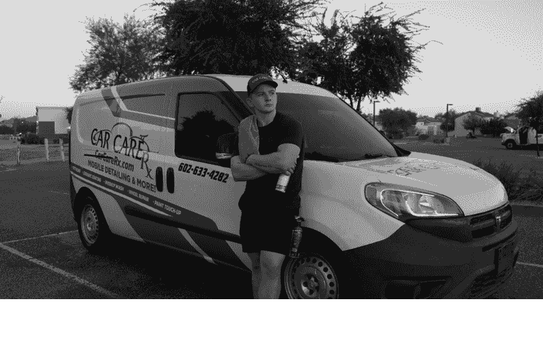 Owner standing in front of CarCareRx Mobile Detailing Van