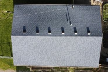 This Cedar Lake, Indiana ranch roof system was covered by State Farm due to tree damage.