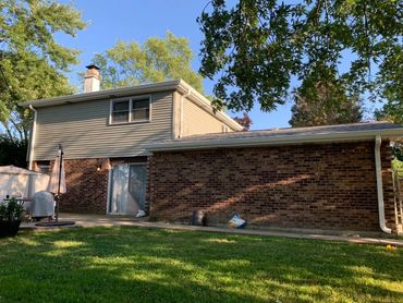 This tri-level home a Atlas PInnacle Roofing system through Total Roofing and Construction.