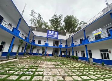 U.E.G College of Paramedical Sciences courtyard with blue and white building.