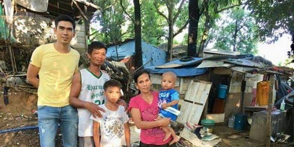 Philippines Manager for Poverty No More, Johnrey. Doing what he usually does -hanging with the needy