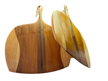 Two wooden cutting boards with handles.