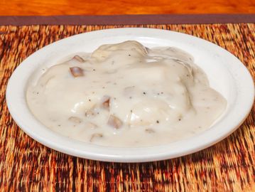 A plate of biscuits and gravy.