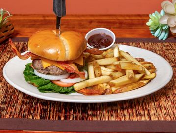 Burger with fries and barbecue sauce.