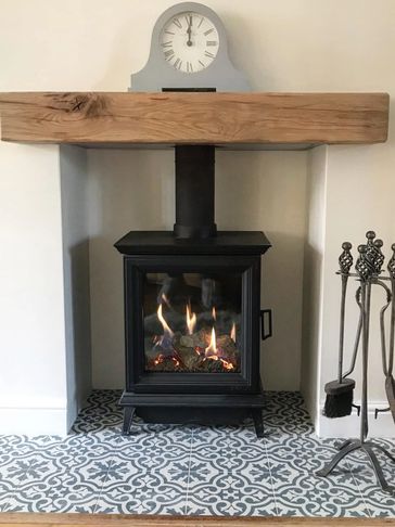 Gazco Sheriton gas stove flue liner with beam and tiled hearth wood burner fitter Andy Yates Ltd