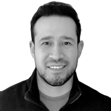 Smiling man with short hair and beard.