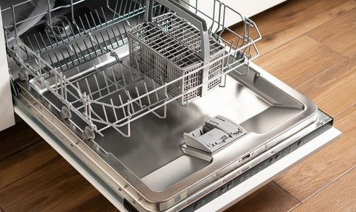 an open dishwasher after an appliance cleaning service