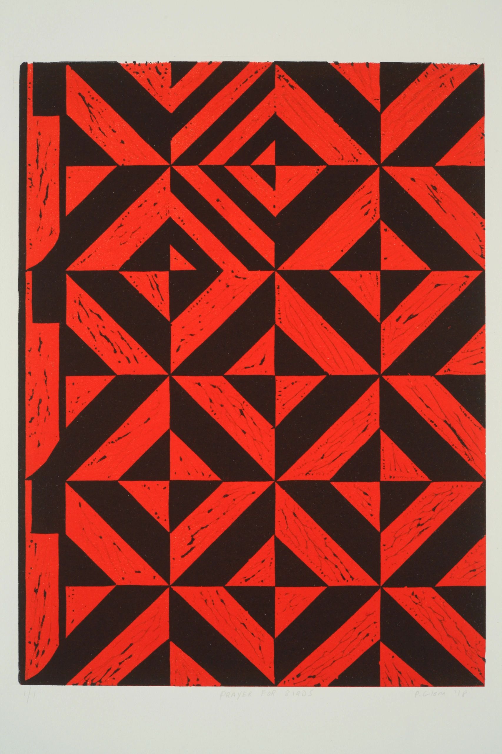 Red and black geometric pattern artwork.