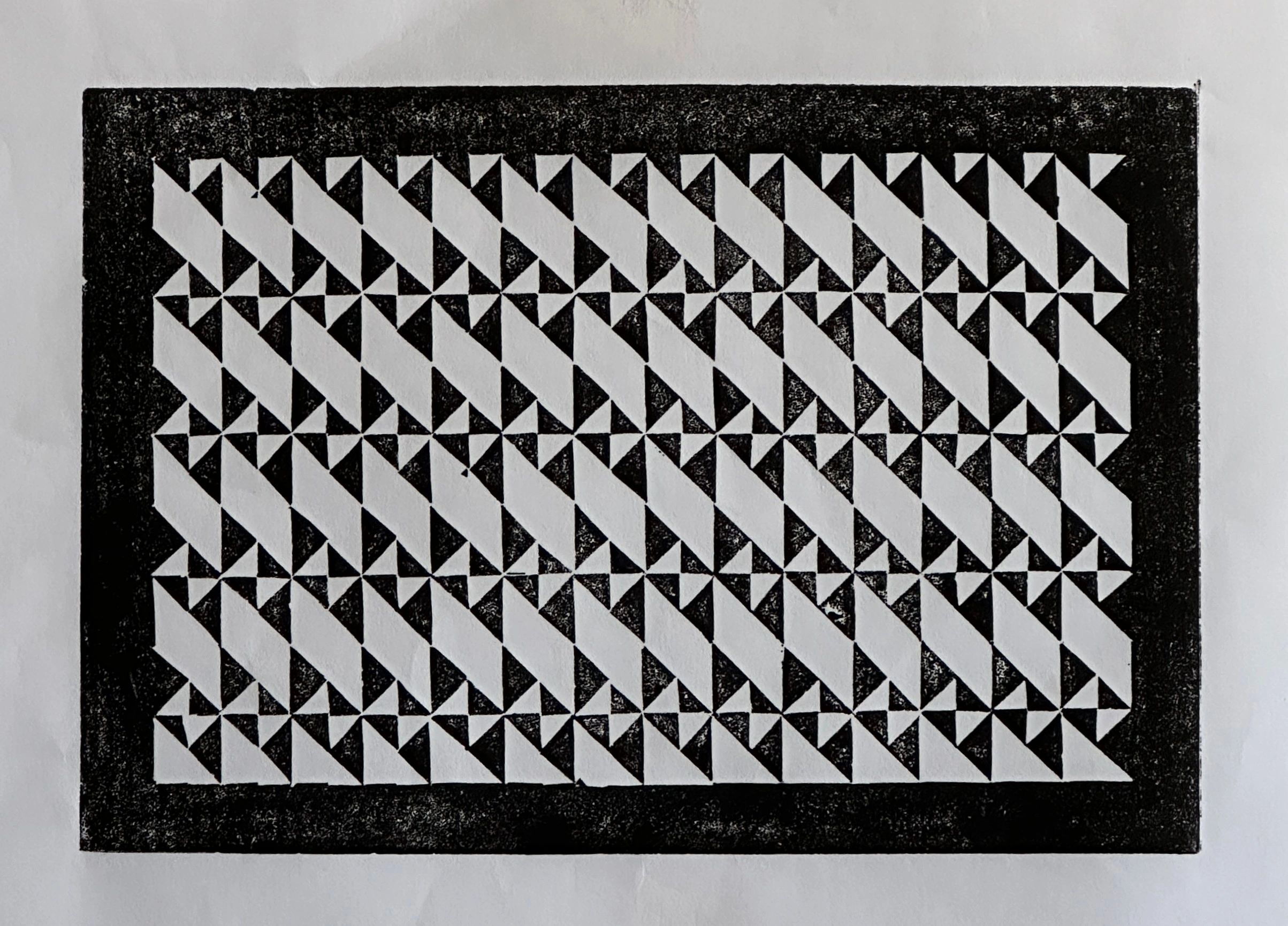 Abstract geometric black and white pattern on paper.