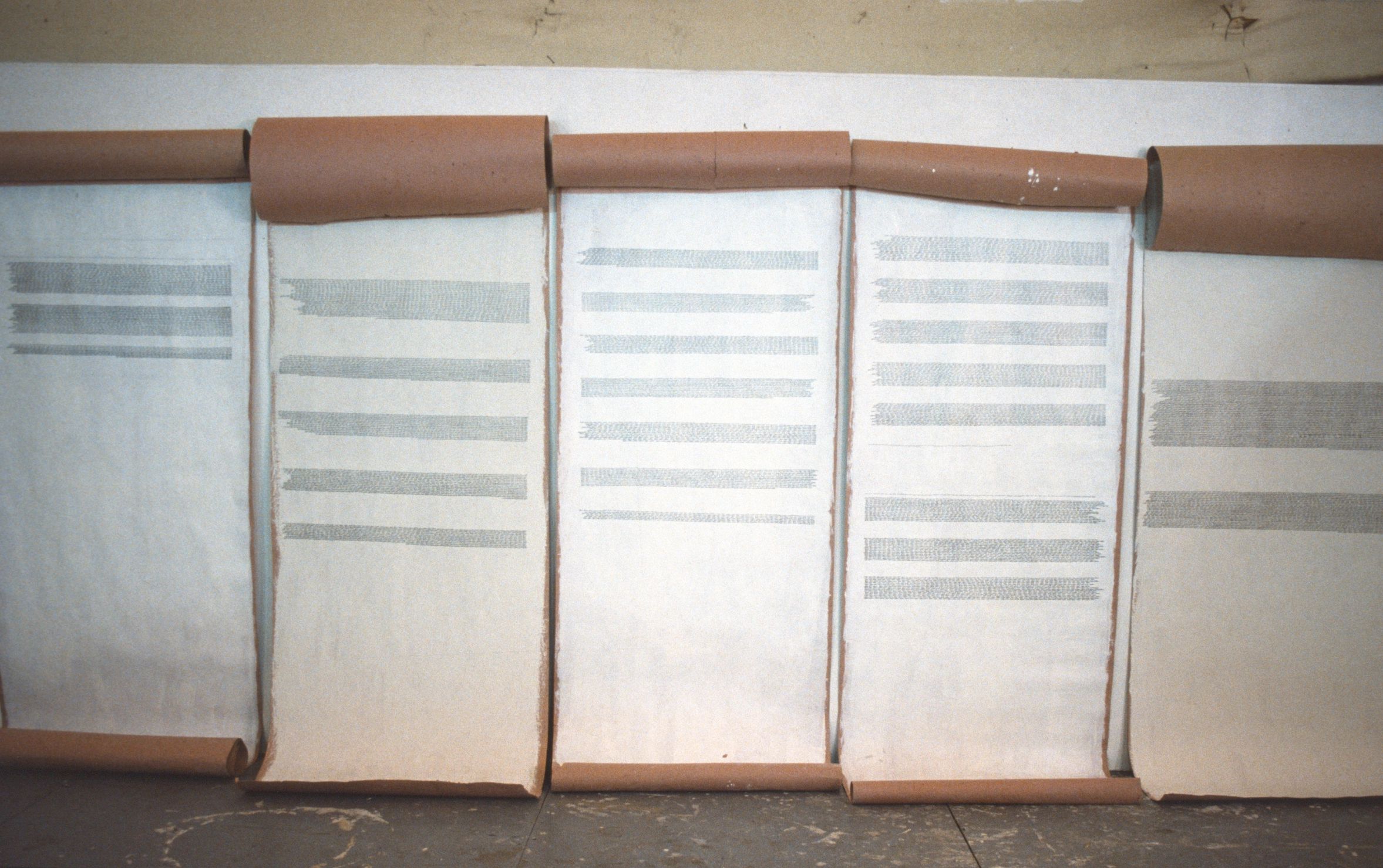 Long scrolls of text on paper.
