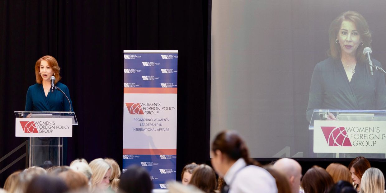 Jennifer Ewbank on stage at Women's Foreign Policy Group event.