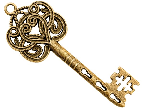 Ornate antique gold key with intricate heart-shaped design.