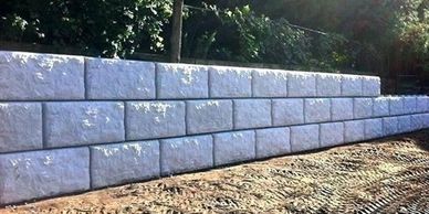 Pre cast concrete retaining wall, landscaping, interlock, armor stone, natural stone, hardscaping, g 