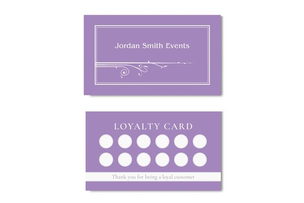 Business card in amethyst color with name of business and art nouveau fleurons.