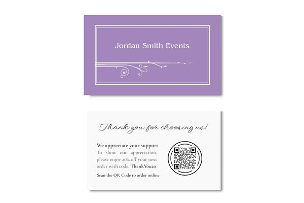 Business card in amethyst color with name of business and art nouveau fleurons.