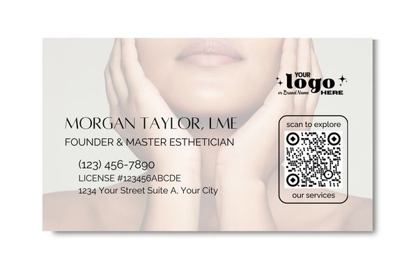 Business card showing woman applying product to her face, in soft focus.