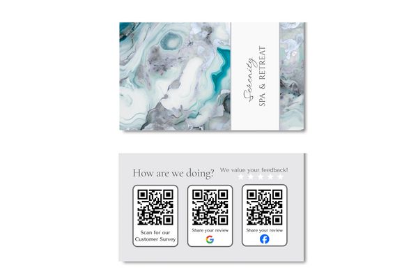 Business card with white, gray and turquoise marbled design and name of company.