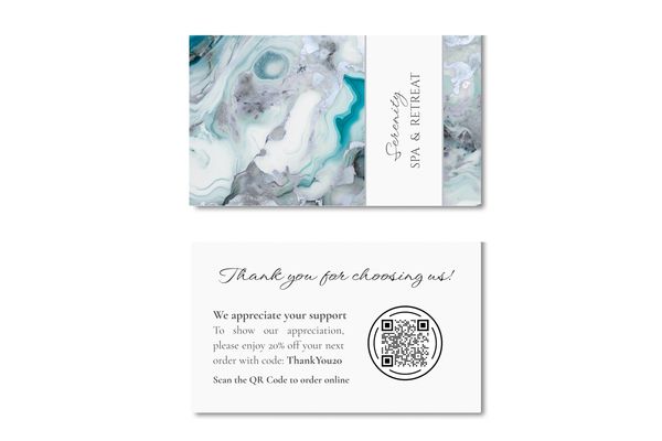 Business card with white, gray and turquoise marbled design and name of company.