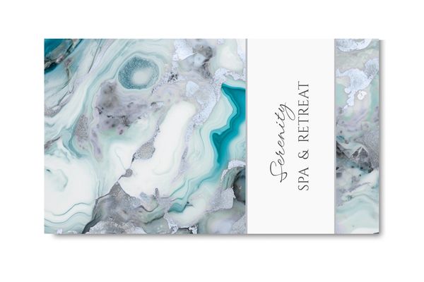 Business card with white, gray and turquoise marbled design and name of company.