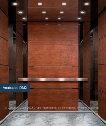Vista frontal de un elevador para pasajeros ASME A17.1 de madera natural y mármol marca GIE