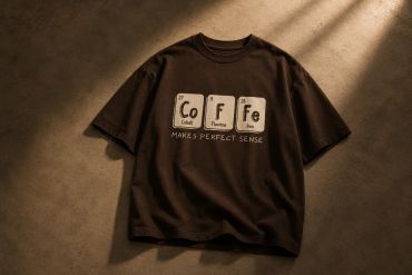 Brown T-shirt with periodic table elements spelling 'CoFFe' and text 'Makes Perfect Sense'.
