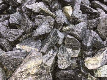 These large stones are Malen Black. These rough stones are black with white marbling.