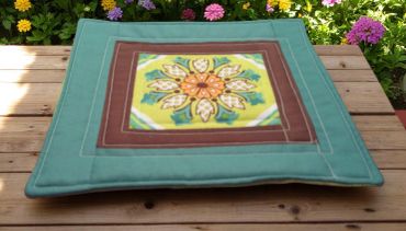 Boho vibes with this vintage inspired mug rug in teal green, lime yellow, orange and brown accents.