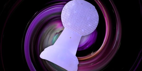 Close-up of patented drip-catching funnel system on U-R-IN urinal screen