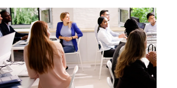Sales team learning sales techniques from a sales expert
