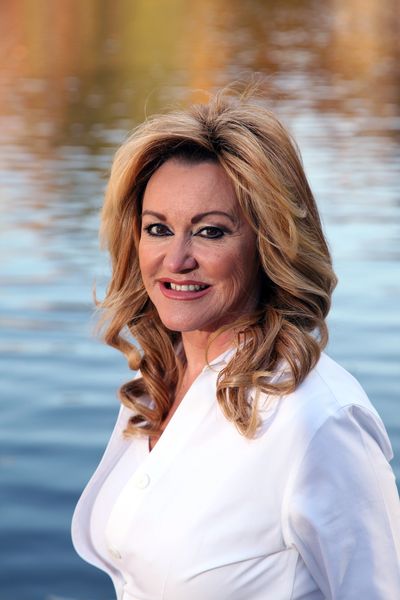 Mikki Funderburke RN closeup with lake background