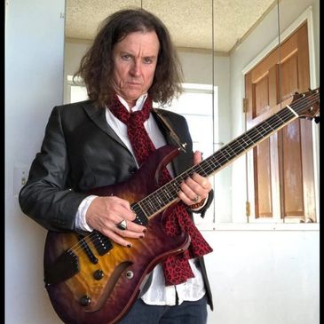 Todd with custom Forshage hollow body  electric guitar.
