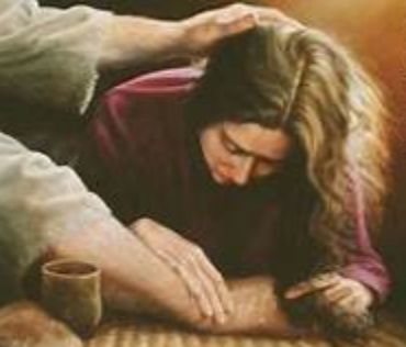 Mary of Bethany anointing the feet of Jesus with her tears and wiping them with her hair.