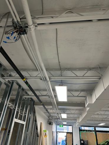 Commercial junction box and overhead LED panel lights.