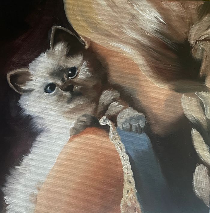 Little girl with kitten.