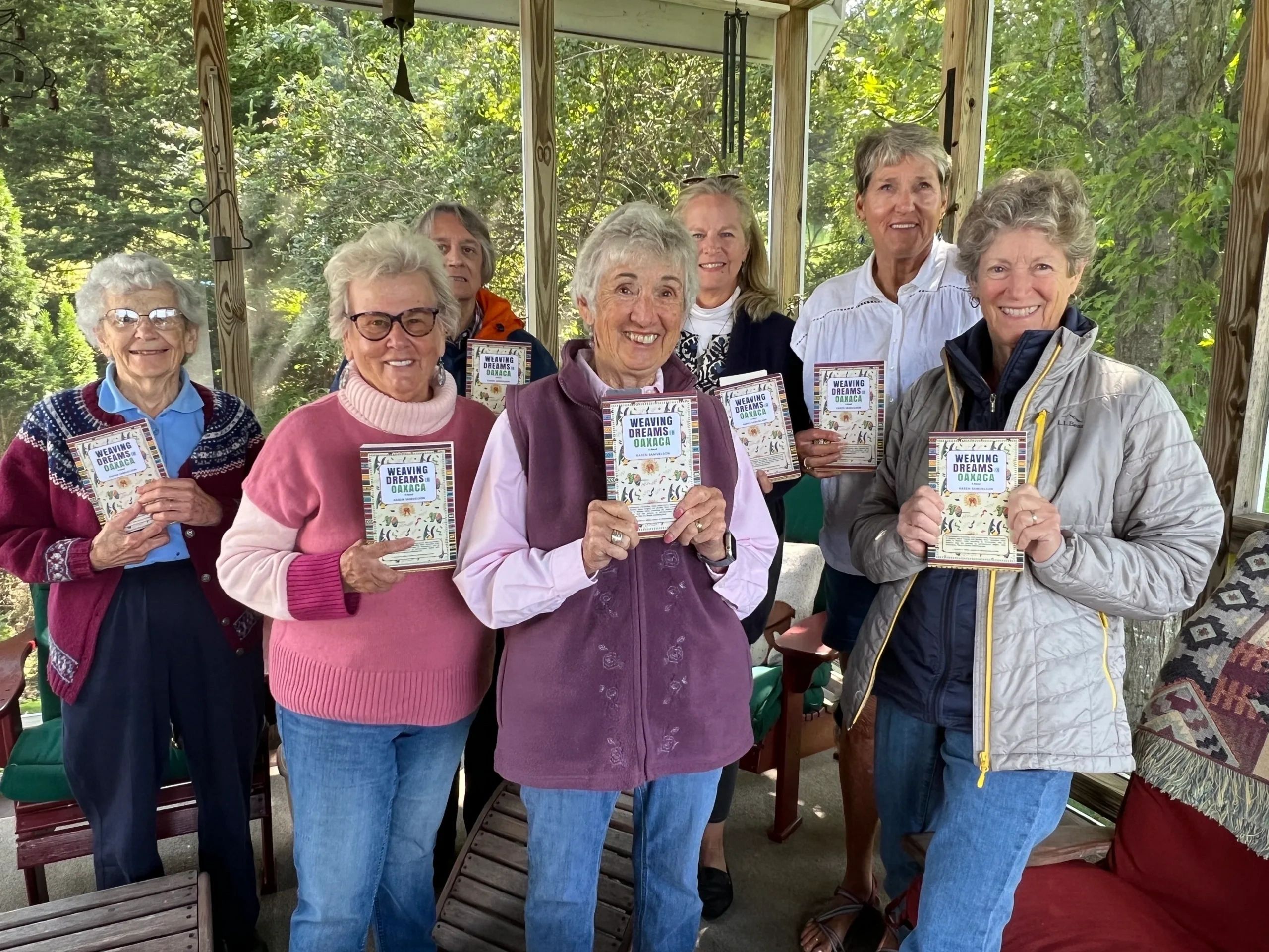 A bookclub in Vermont holding my novel, Weaving Dreams In Oaxaca.