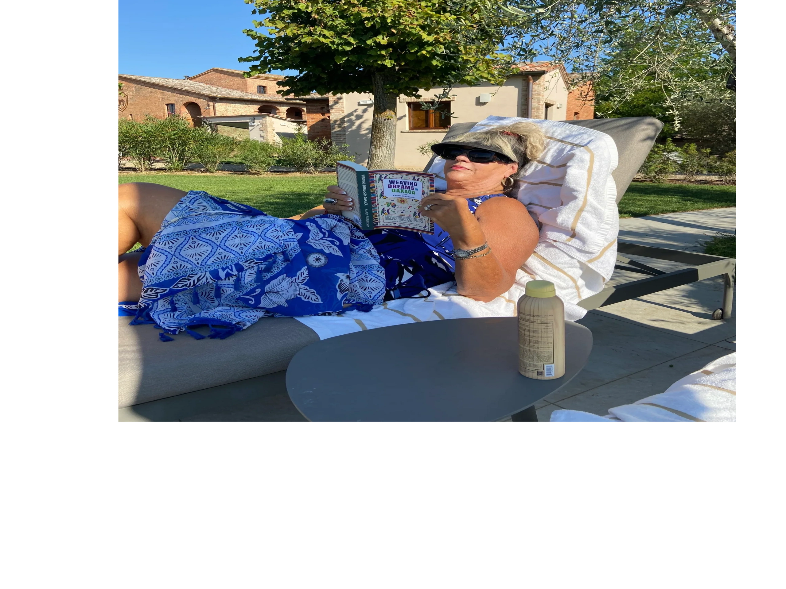 A woman in Tuscany, Italy reading my book.