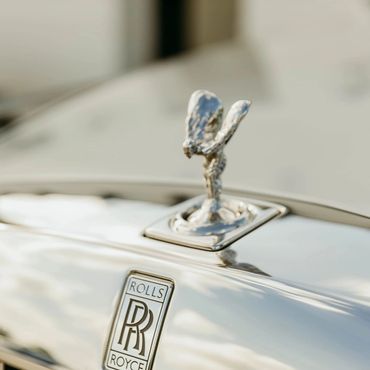 Rolls-Royce car hood ornament and emblem.