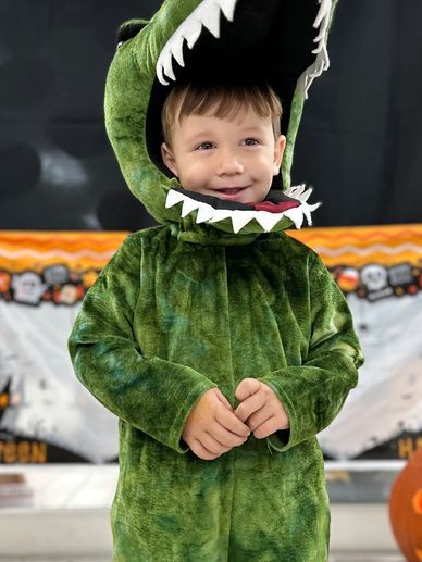 Toddler dressed as a dinosuar