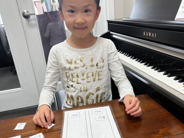 Piano theory games during lessons at Synergy Music Academy